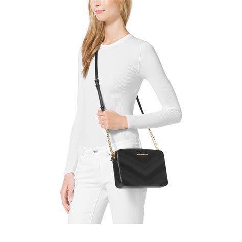 michael kors jetset travel black crossbody clutch bag|Michael Kors jet set vanilla.